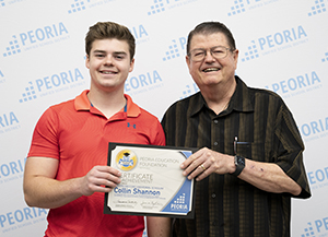 LHS Scholarship winner poses with father.